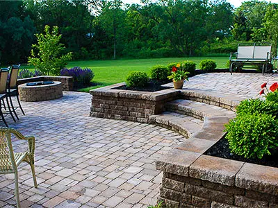 raised patio and fire feature backyard landscape