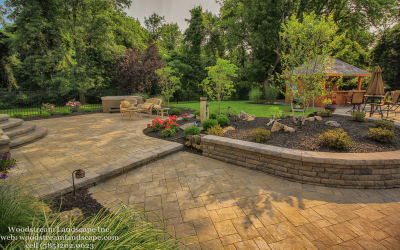 Landscape renovation after completion, new patio, landscaping, wall, steps