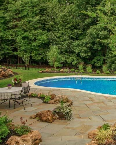 Natural boulders, pool, flagstone patio, planting