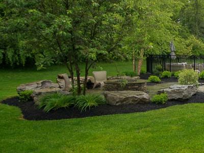 Landscape boulders, firepit, landscaping