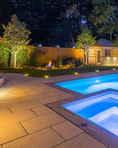 inground pool, patio, landscape lighting and landscape planting