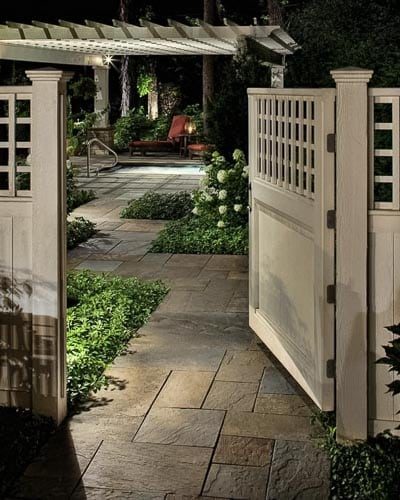landscaping Backyard. landscape lighting, flagstone patio, plantings.